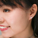 illusion diamond earrings modeled