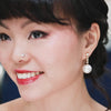 glam south sea pearl dangling diamond earrings