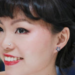 blue sapphire flower diamond earrings modeled