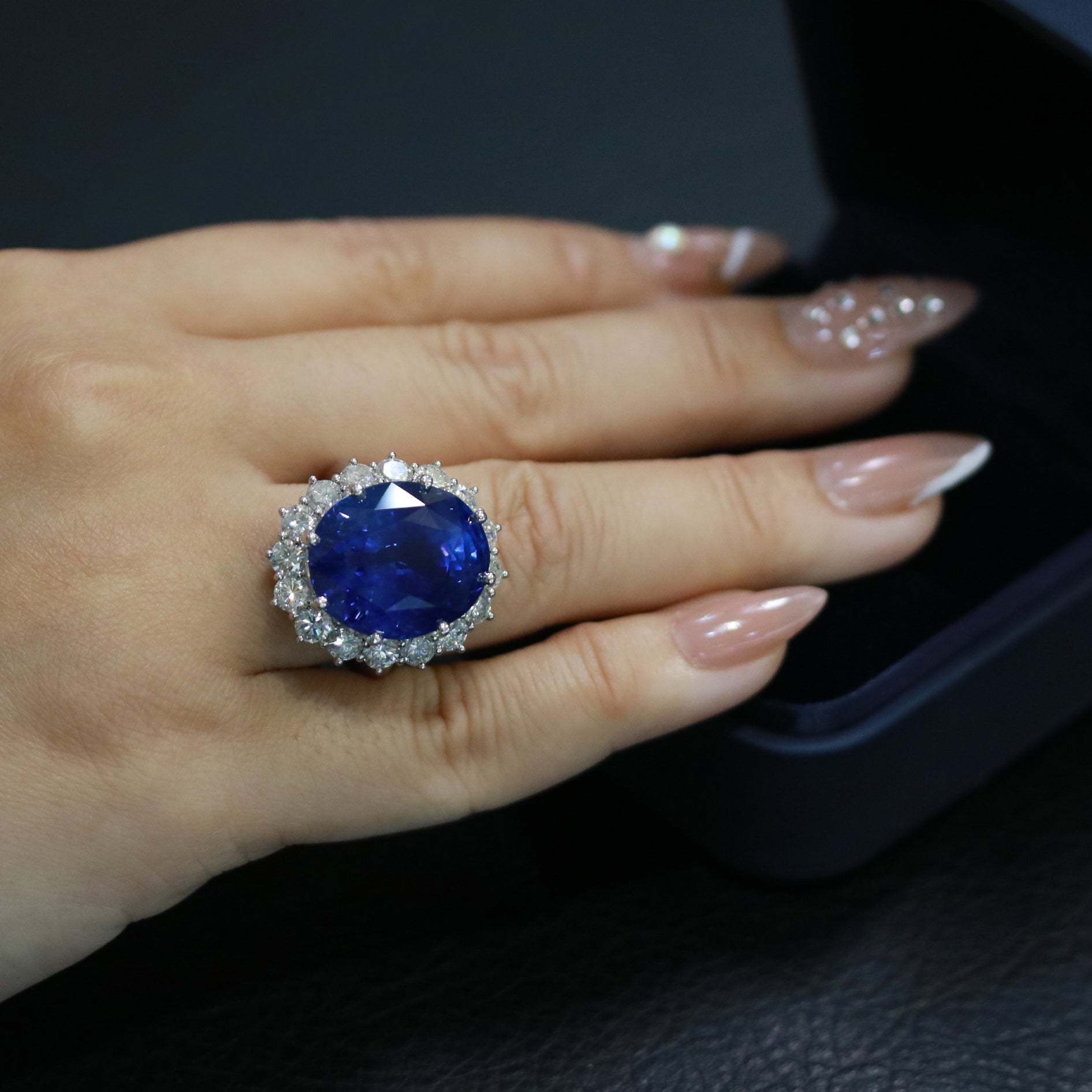 An Impressive Sapphire Diamond Ring featuring a vibrant sapphire center stone with brilliant diamonds