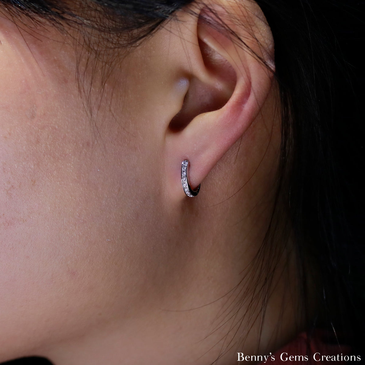model with cute diamond loop earrings