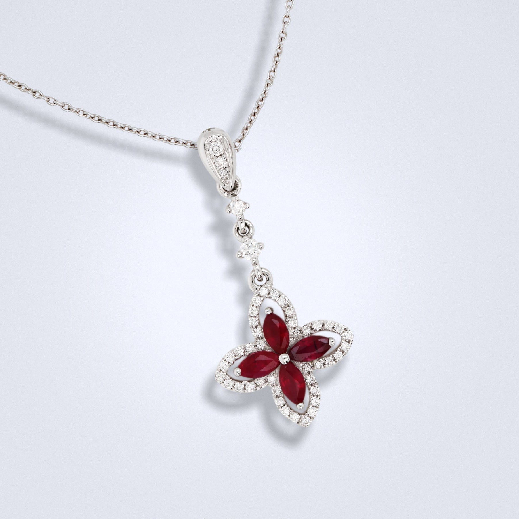 red ruby diamond pendant in an ixora shape design