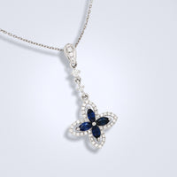 blue sapphire diamond pendant in an ixora shape design