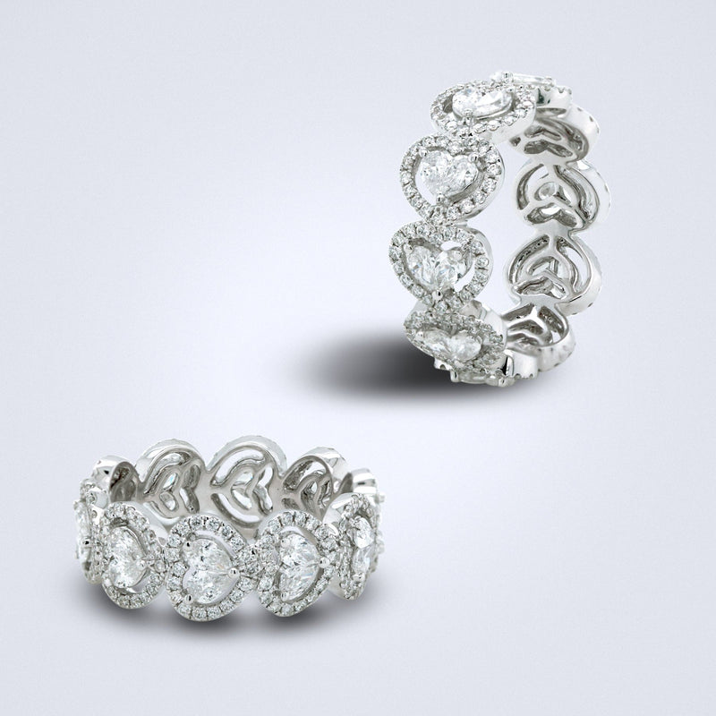 an eternity diamond ring with pear cut diamonds set to look like heart shapes.