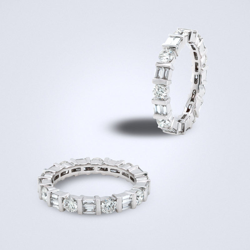 Diamond ring with a full circle of sparkling round-cut diamonds and baguette diamonds set in white gold.