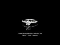 Elegant diamond engagement ring featuring a brilliant center stone and micropave diamond band