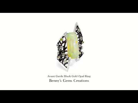 Avant Garde black gold opal ring featuring a mesmerizing play of color and modern artistic design