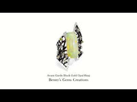 Avant Garde black gold opal ring featuring a mesmerizing play of color and modern artistic design