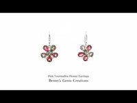 Pink tourmaline flower earrings with vibrant pink gemstones arranged in a floral design, set in fine metal for an elegant feminine look.