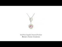 18K white gold sapphire and diamond pendant featuring 1 pink sapphire (1.50 ct), 1 blue sapphire (2.09 ct), 1 pear-cut diamond (0.45 ct) and 66 diamonds (0.823 ct), chain sold separately.
