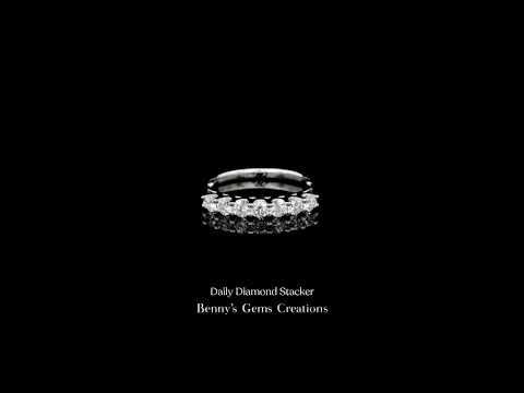 Daily Diamond Stacker ring in 18K white gold, set with 7 diamonds totaling 0.46 carats.