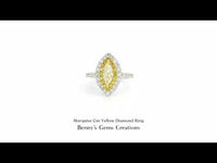 Marquise Cut Yellow Diamond Ring with sparkling side stones in gold setting