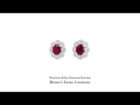 18K white gold ruby and diamond earrings featuring 2 rubies (2.77 ct total) and 96 diamonds (0.60 ct total).