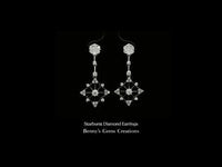 Starburst diamond earrings featuring brilliant round-cut diamonds in a radiant star design, elegant fine jewelry for special occasions