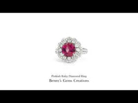 Elegant platinum ring featuring a vivid ruby center stone accented with diamonds