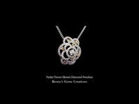 Petite Flower Bloom Diamond Pendant showcasing radiant diamonds with delicate floral design