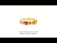 Rainbow Sapphire Kaleidoscope Eternity Ring – colorful eternity band adorned with a continuous row of vibrant rainbow sapphires.