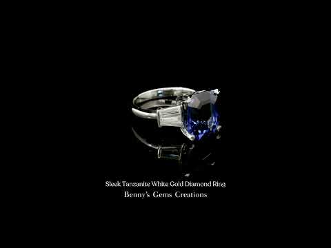 Sleek diamond ring with vivid blue tanzanite center stone crafted in a slim, polished setting.