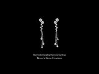 Star Trails Dangling Diamond Earrings with star trail design and brilliant shimmer