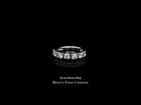 Elegant seven stone ring featuring sparkling round-cut diamonds set in a classic band design, symbolizing everlasting love and unity