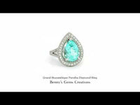 Grand Mozambique Paraiba Diamond Ring featuring vivid neon blue-green center stone with sparkling accent diamonds, in fine white gold setting