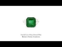 Emerald Love Trilogy Diamond Ring featuring a vibrant emerald center stone with sparkling diamond side stones