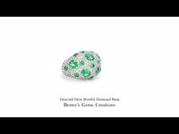 Emerald Glow Bombé diamond ring featuring a vivid green emerald centerpiece surrounded by sparkling diamonds in an elegant bombé design, perfect for luxury jewelry lovers.