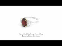 Pigeon Blood Ruby Trilogy Diamond Ring featuring a vivid red ruby centerpiece with sparkling diamond side stones