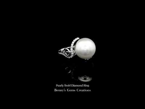Pearly Swirl Diamond Ring featuring an elegant swirl design adorned with brilliant diamonds and a lustrous pearl centerpiece set in fine gold.