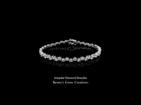 Irregular diamond bracelet featuring uniquely shaped diamonds set in a modern and artistic gold design.