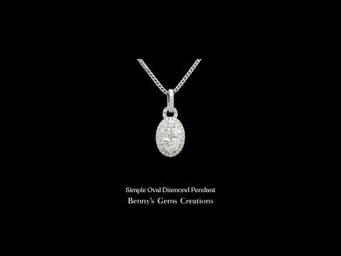 Simple Oval Diamond Pendant with sparkling accent diamond in minimalist design
