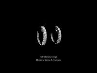 Half Diamond Loops – elegant hoop earrings partially adorned with sparkling diamonds.