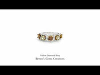 Yellow Diamond Ring in elegant gold setting with sparkling accents