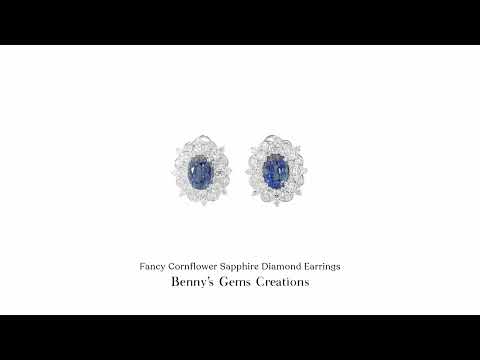 18K white gold sapphire and diamond earrings featuring 2 sapphires (3.54 ct total) and 64 diamonds (1.39 ct total), with jewellery report.