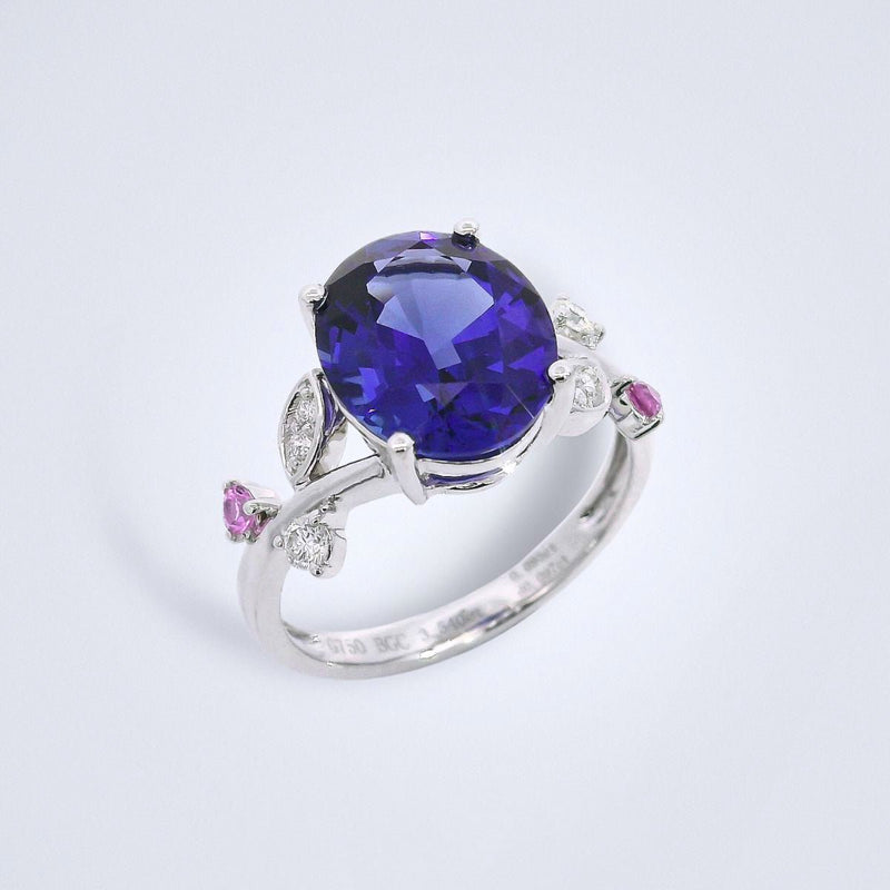 A floral inspired, delicate tanzanite ring made in 18k white gold, with diamonds and sapphires.