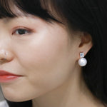 pearl illusion diamond earrings modeled